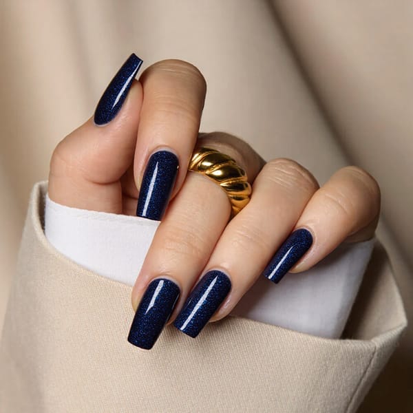 How about medium square nails in a deep midnight blue with a subtle starry shimmer effect for winter nights?
