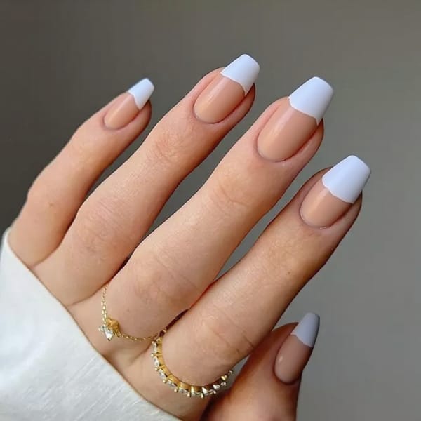 Medium stiletto nails in a half-and-half design—half of each nail matte, half glossy, for a striking statement.