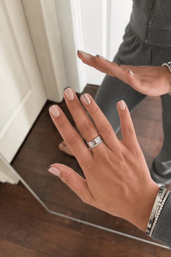 sophisticated minimalist w/ an edge Nail shape: square. Nail length: short. Only change the nails visible in the image to match this design. Keep the rest of the image — the hand, skin, background, lighting, and everything else — exactly the same.