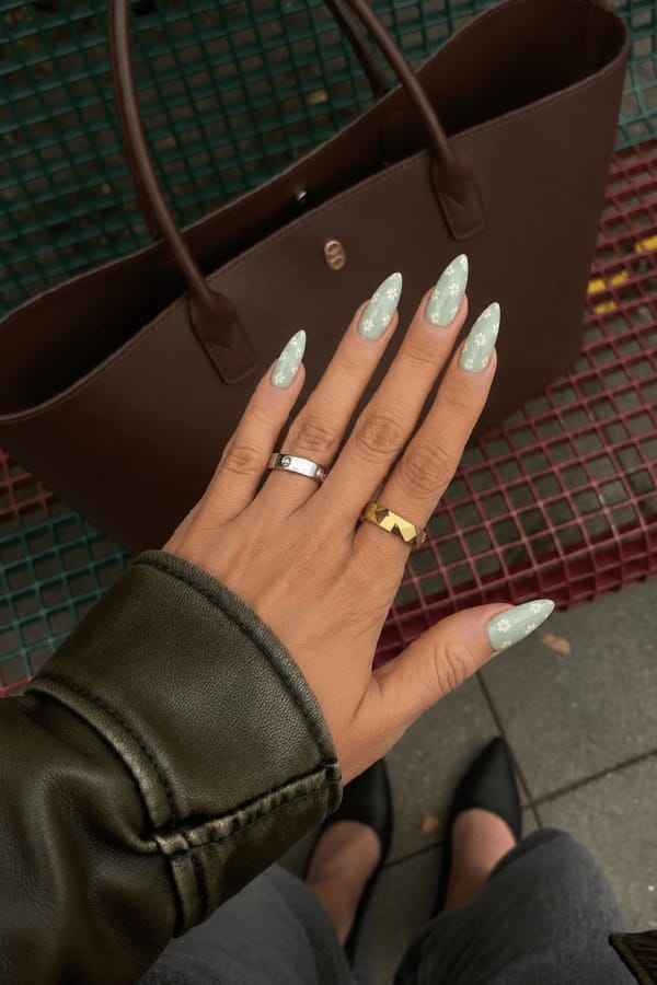 Mint green base with tiny white daisies and a glossy top coat