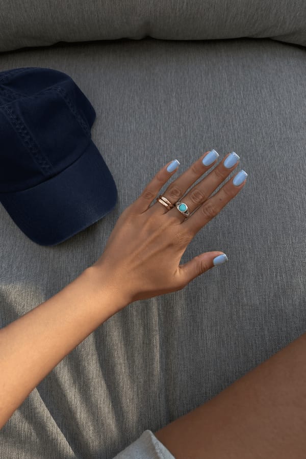 Baby blue base and silver glittery tips for a dreamy aesthetic
