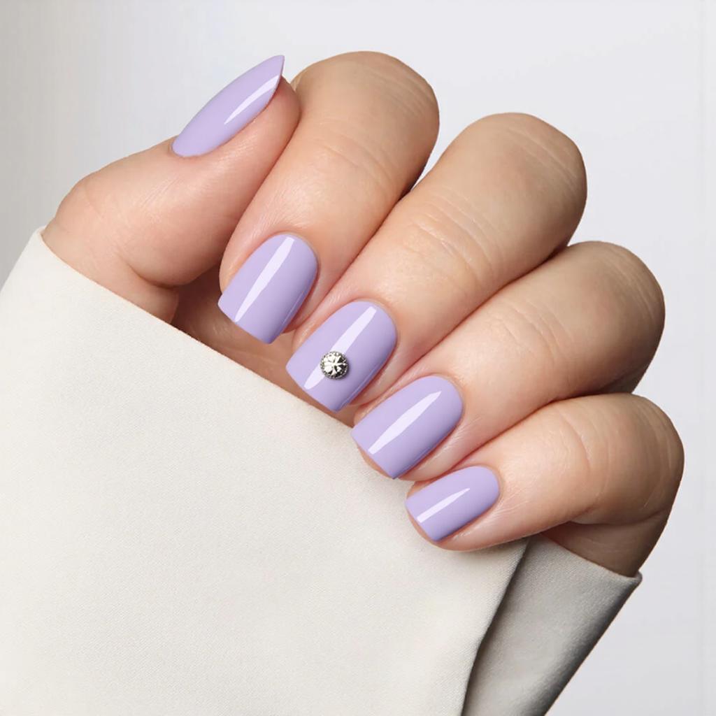 Please do short nails in a soft lavender with a tiny silver stud on the middle nail for a subtle accent.