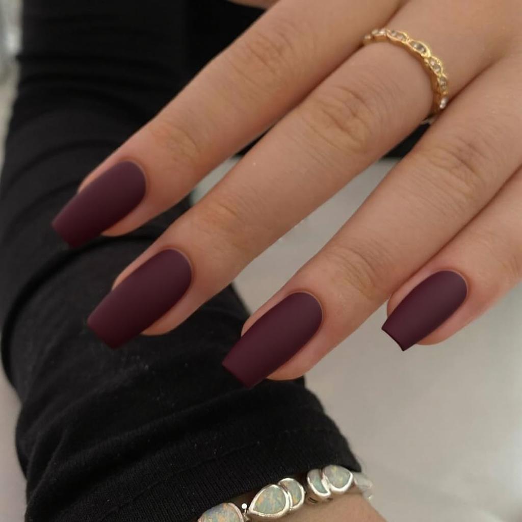 Short stiletto nails in matte burgundy, perfect for a chic everyday statement.