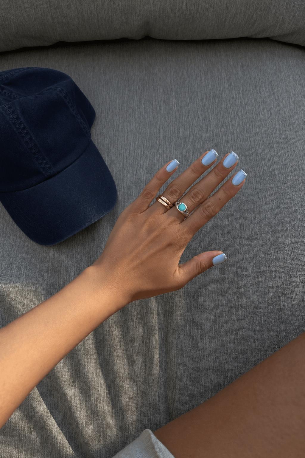 Baby blue base and silver glittery tips for a dreamy aesthetic