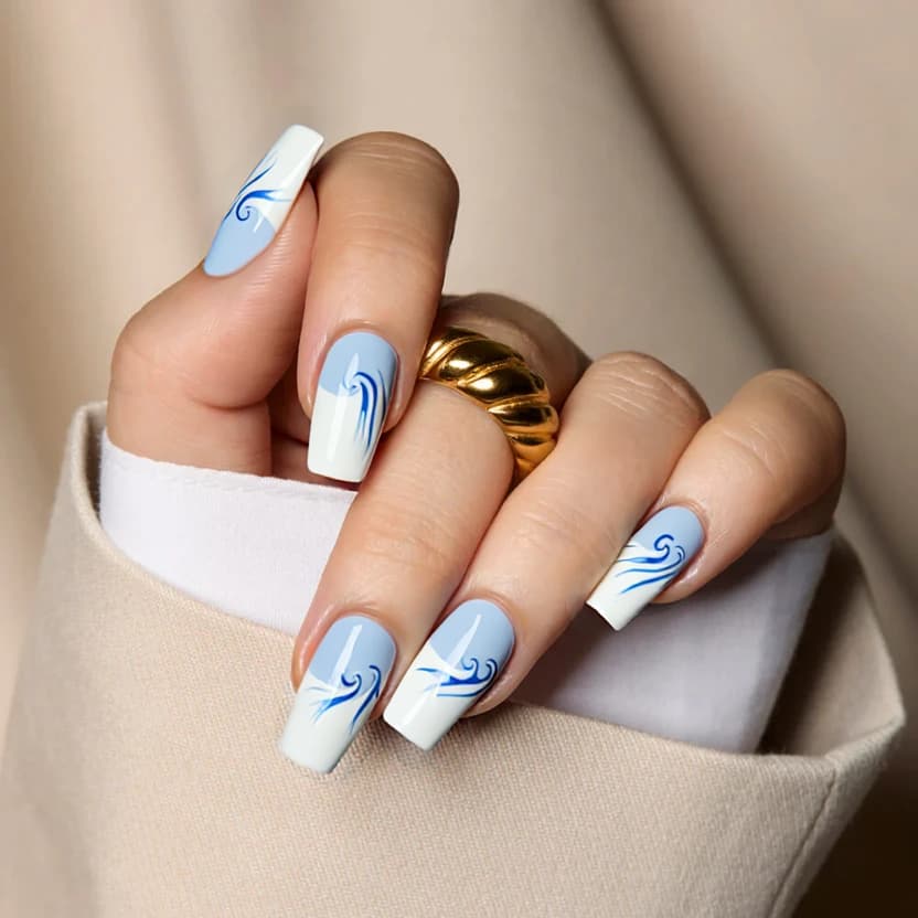 Nails feature a classic French tip design with a soft, pastel blue color across the tips, creating a light and airy feel. The base of each nail is a clean, milky white, allowing the blue tips to stand out beautifully. On the ring fingers, an elegant, minimal design is added with delicate swirls in the same pastel blue, echoing the French tip. The swirls are kept subtle, with no more than three per nail, ensuring a harmonious balance. A glossy finish will enhance the clean lines and provide a polished look suitable for medium square nails.