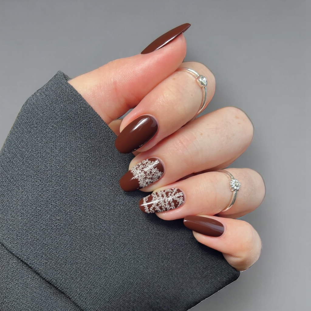 Short almond nails in a rich chocolate brown with a soft, fuzzy sweater design on one accent nail.
