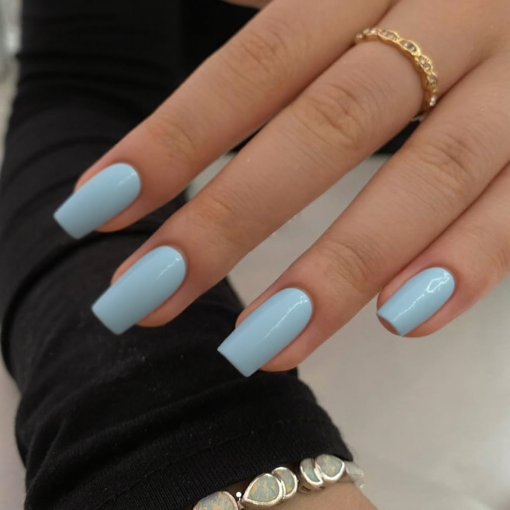 Short stiletto nails in a classic French tip, but make the tip a soft baby blue for a playful look.