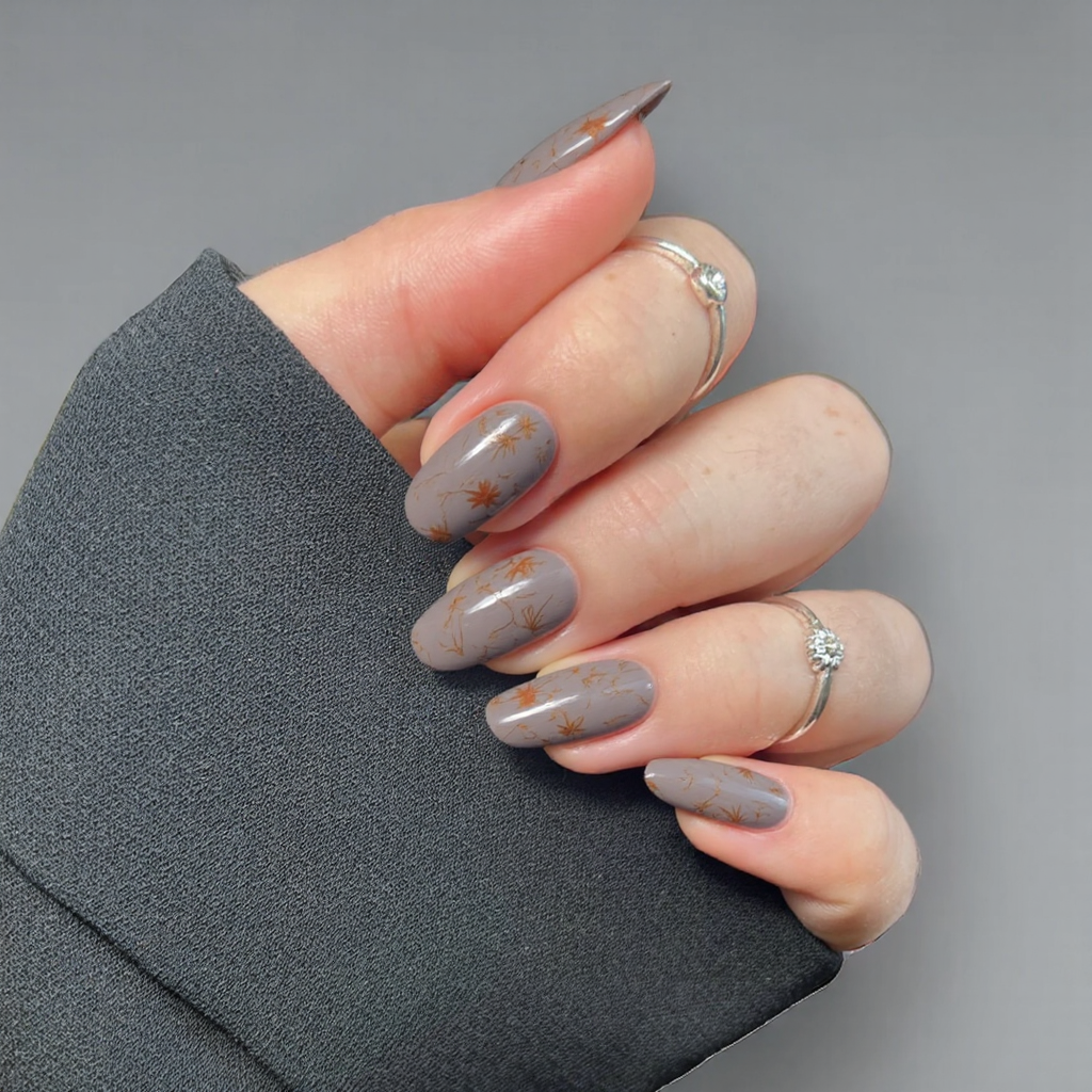 I want a short almond mani in a muted taupe with a subtle, abstract swirl pattern reminiscent of fall foliage.