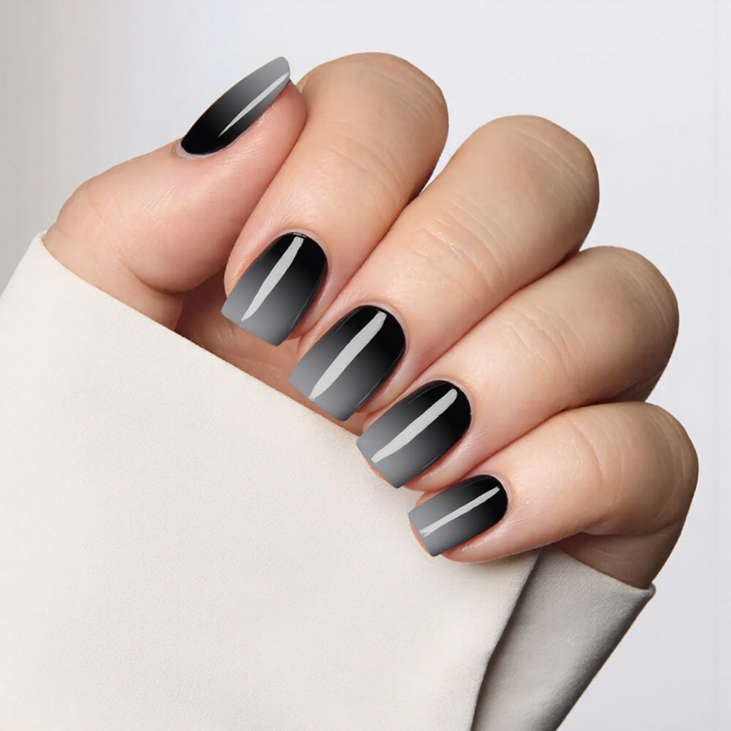 Short square nails with a classy black to grey ombre, perfect for a sophisticated and modern look.