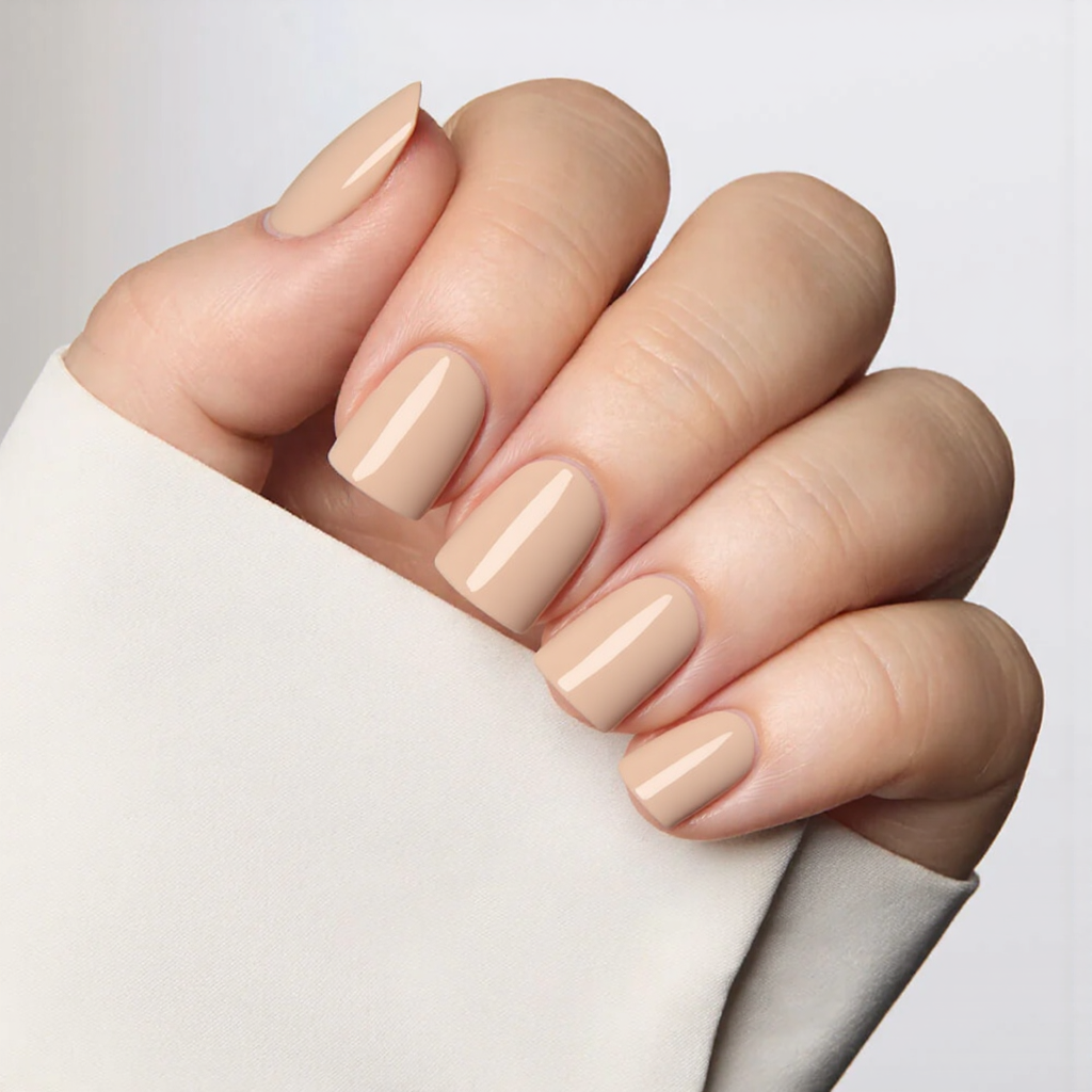 Short square nails painted a light beige with a glossy topcoat, nothing else needed.