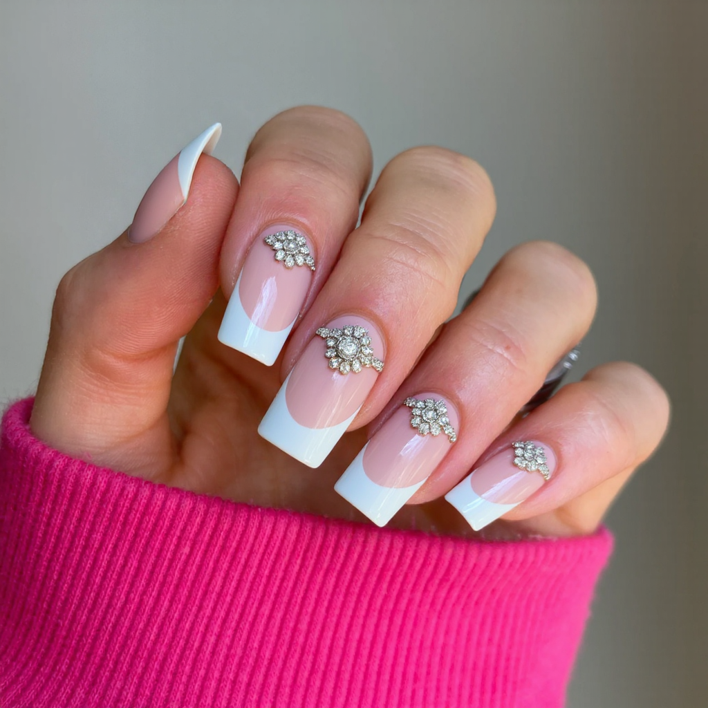 Long square nails in a classic French tip, each ring finger embellished with a subtle rhinestone cluster for a bridal touch.