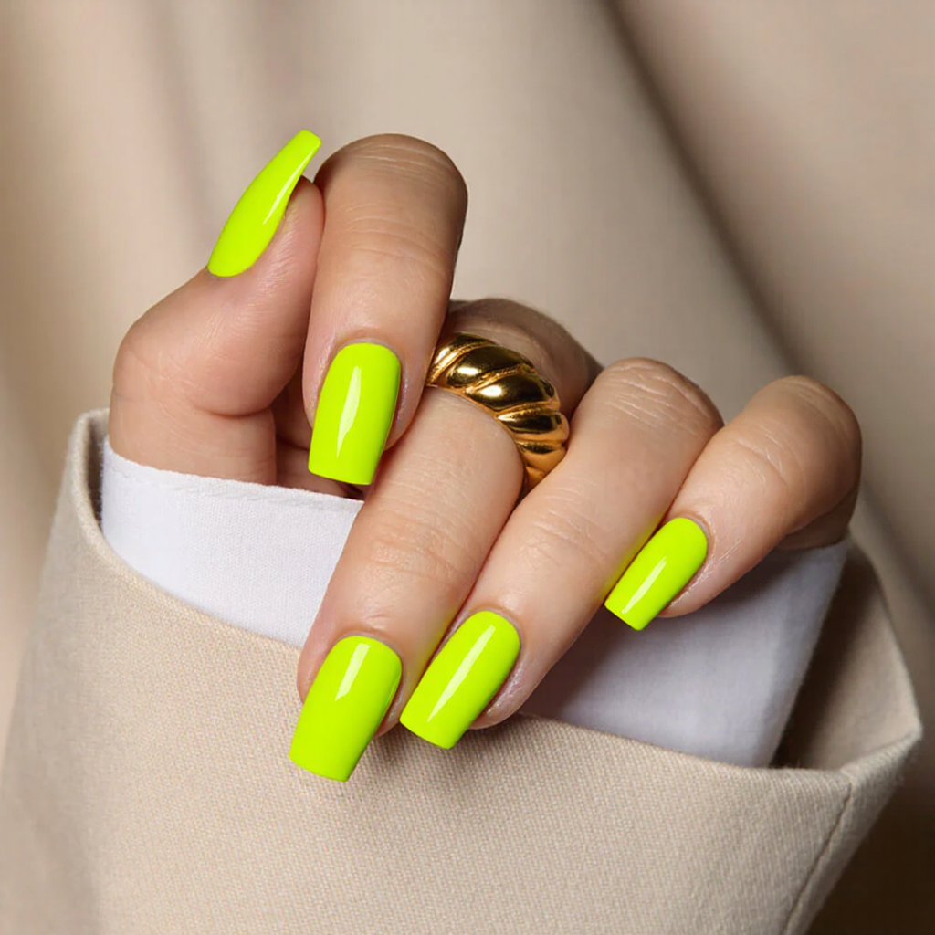 Medium square nails in a bold neon yellow, finished with a clear topcoat for a summer-ready vibe.