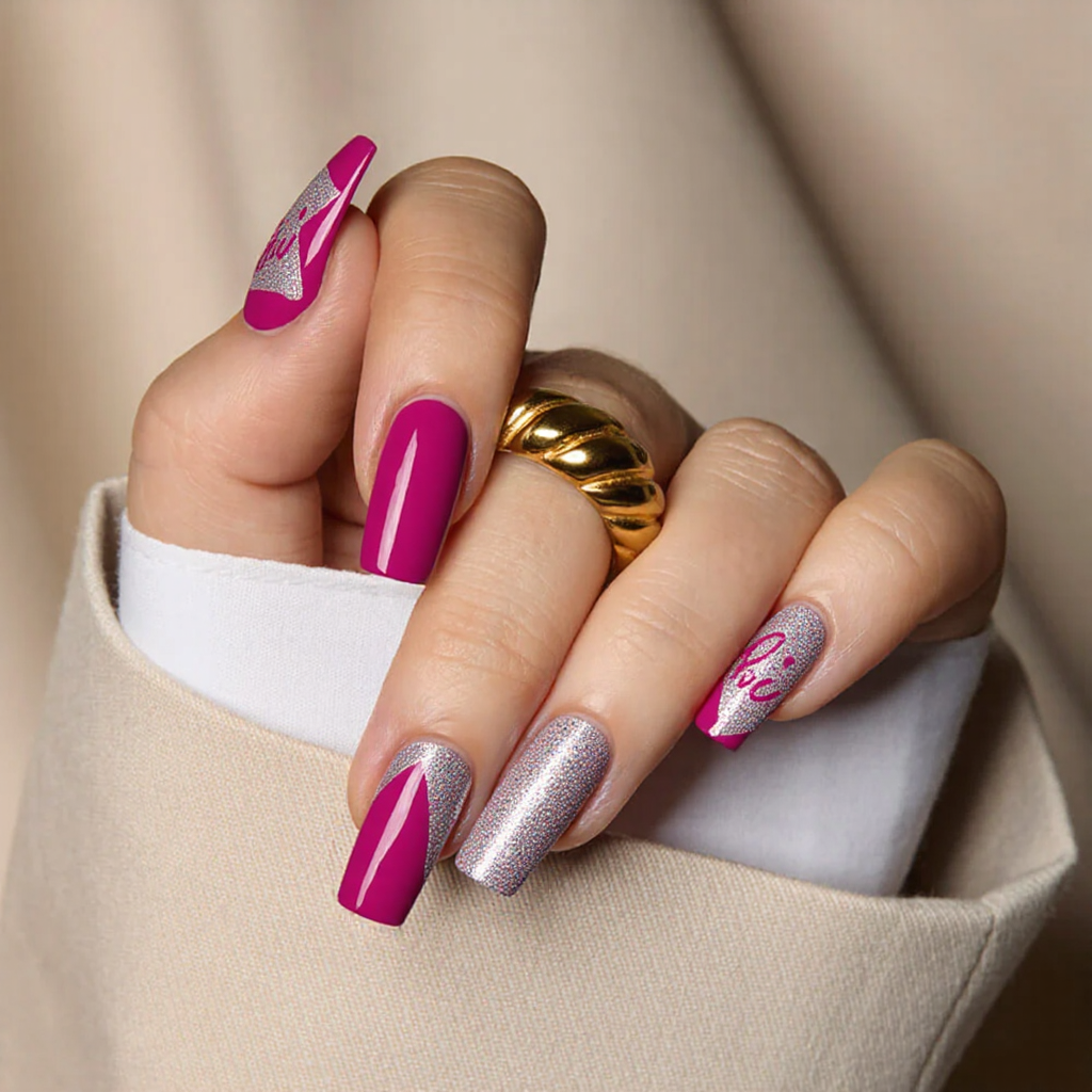 Medium square nails in a Barbie-pink base, plus a single holographic accent nail for a playful look.