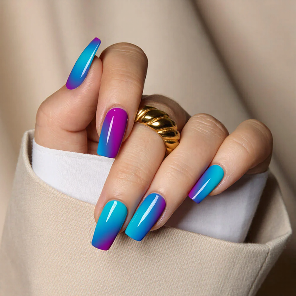 Medium square nails featuring a gradient ombre from electric blue to neon purple, capturing 2025's vibrant color trends.