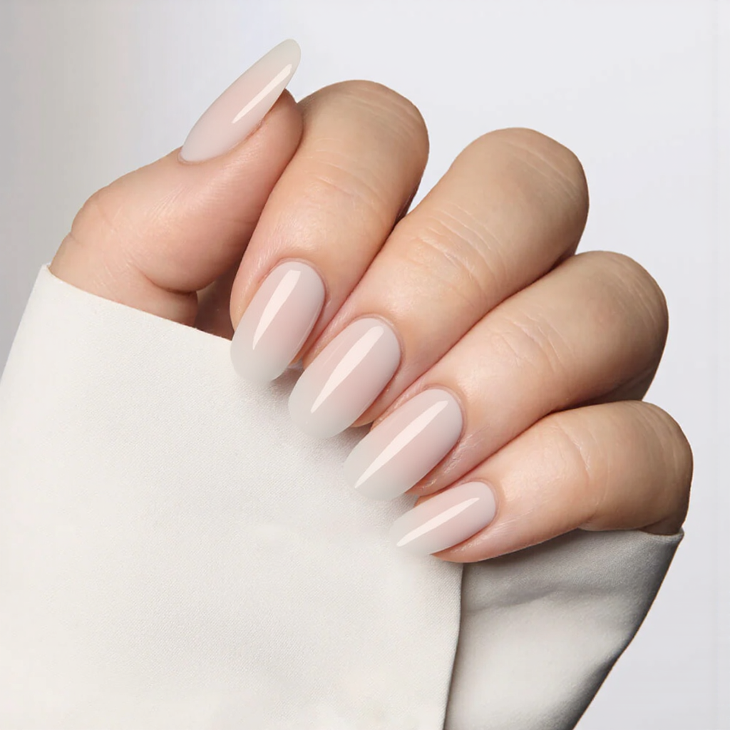 Medium almond nails in a translucent milky white, perfect for a dreamy, soft-focus effect.