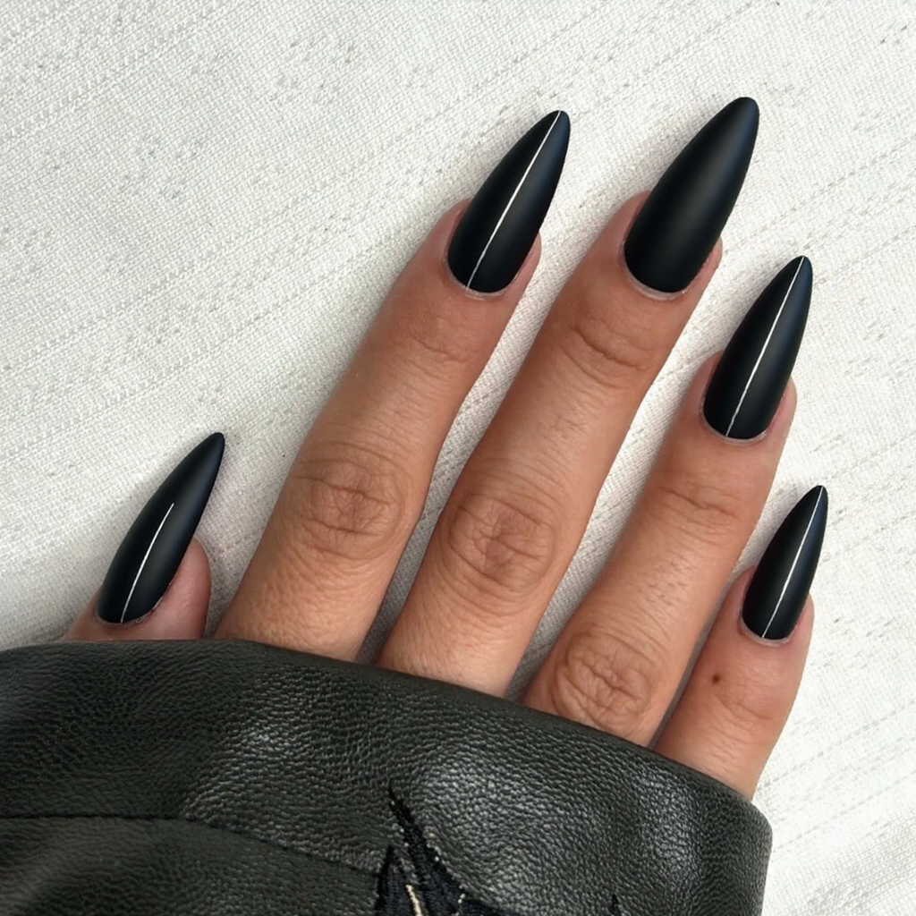 I want long stiletto nails in matte black with just one thin silver stripe on each accent nail.
