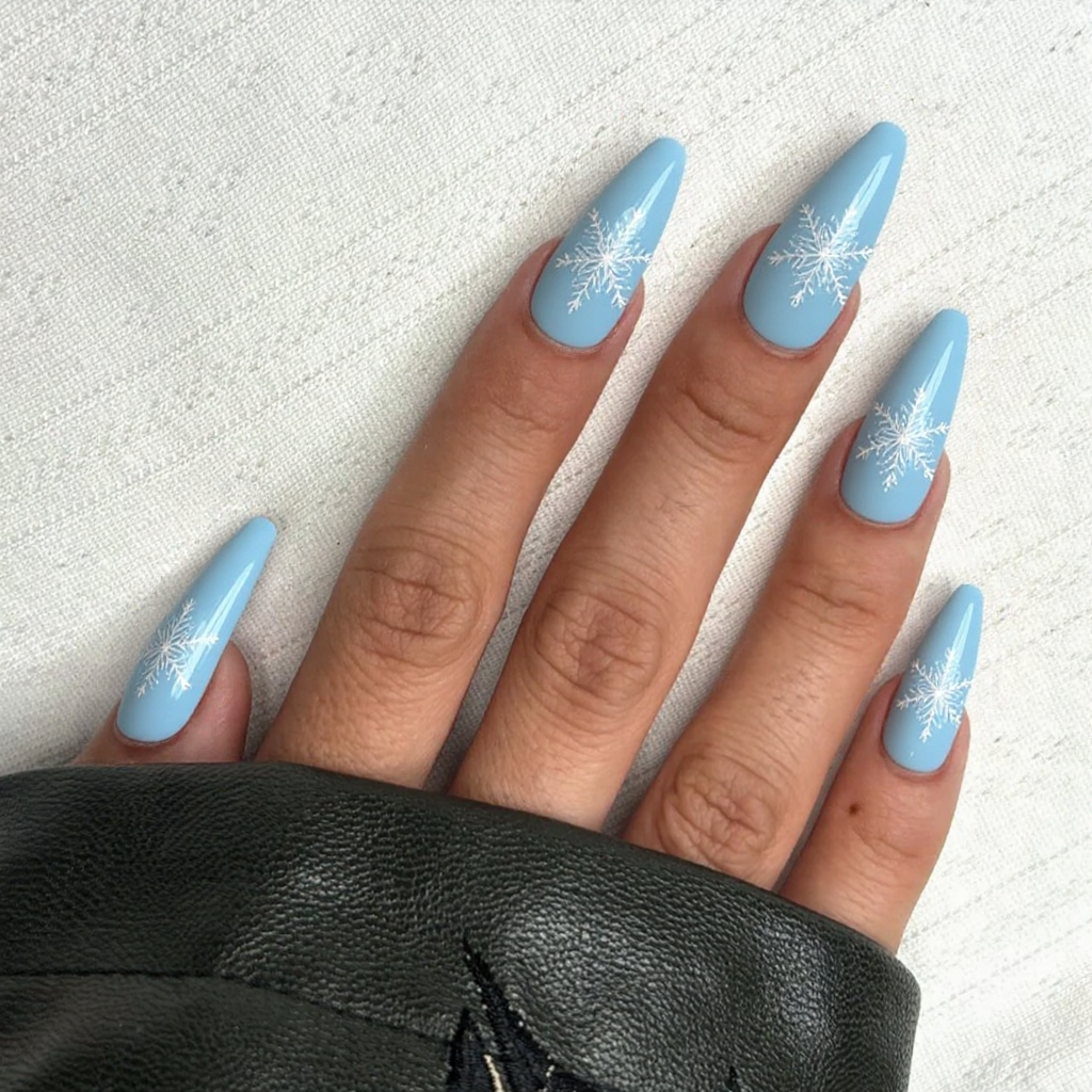 I want long stiletto nails in a classic ice queen style: pale blue base with snowflake decals.