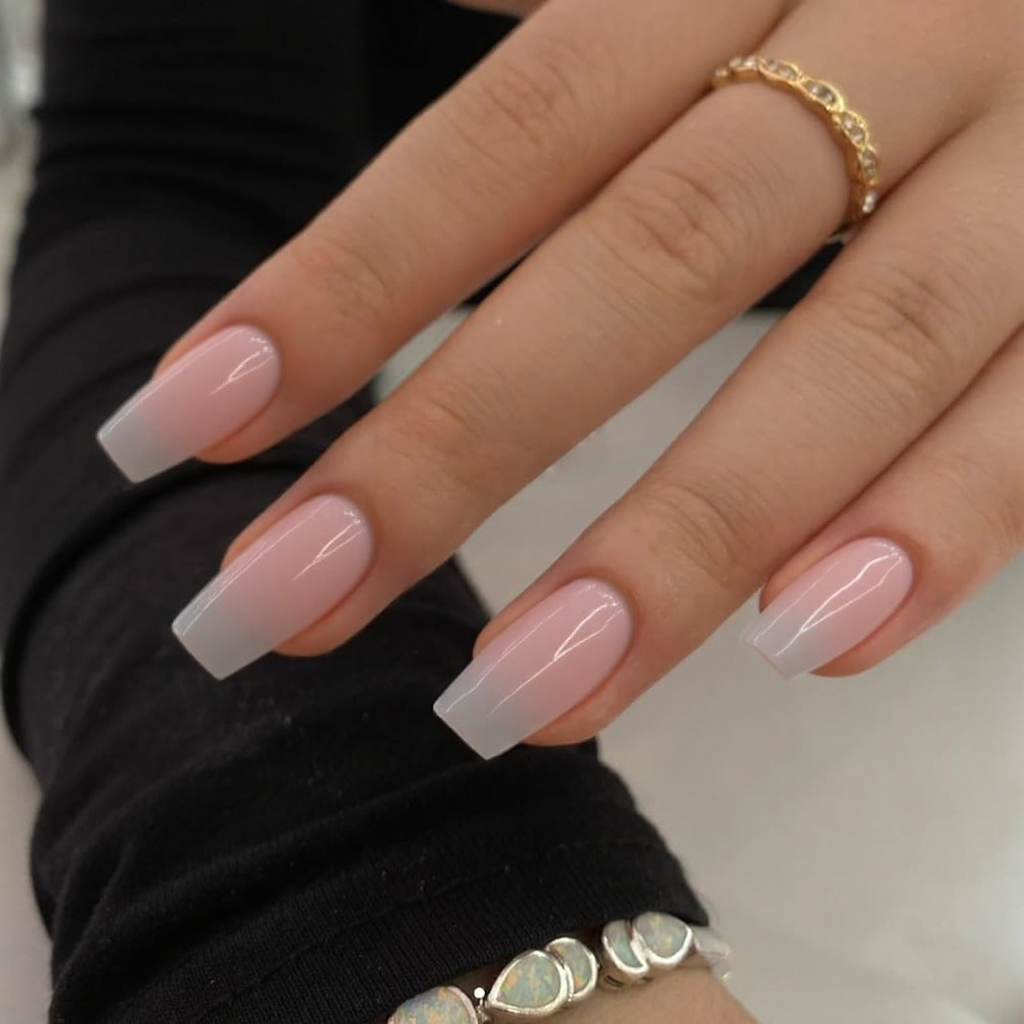 Short stiletto nails in a translucent jelly finish—clear pink with a glossy topcoat for a trendy vibe.