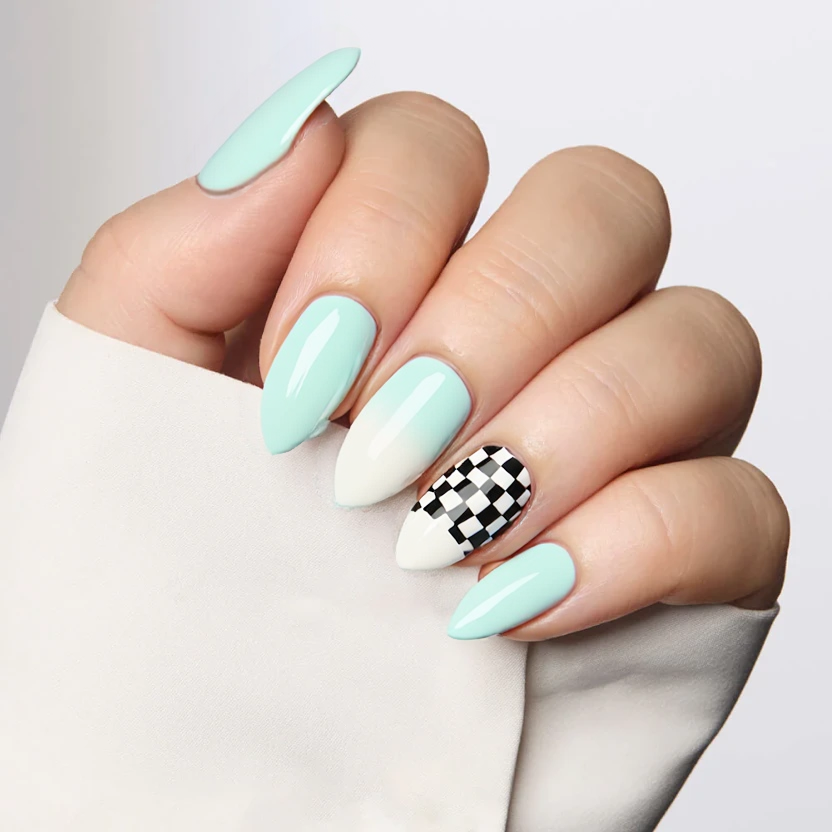 Nails with a delicate mint gradient that transitions smoothly from a soft mint at the cuticle to a lighter, almost white tip, creating a serene yet intriguing look. The middle and ring fingers feature a minimalistic chessboard pattern, with alternating squares of mint and white, adding a playful twist while maintaining elegance. The almond shape beautifully complements the flowing gradient, and the design is finished with a glossy top coat to enhance the overall brightness and sophistication of the mint hues.