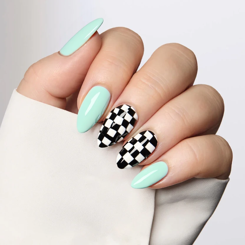 Nail design featuring a soft mint gradient that transitions from a light pastel mint at the cuticle to a slightly deeper shade at the tips across all nails, creating an elegant and serene backdrop. The middle and ring fingers showcase a chic chessboard pattern, delicately alternating between mint and pristine white squares, arranged in a minimalistic fashion to maintain a sophisticated look. The overall finish is glossy, enhancing the gentle gradient and the striking contrast of the chessboard while perfectly complementing the graceful almond shape of the medium-sized nails.