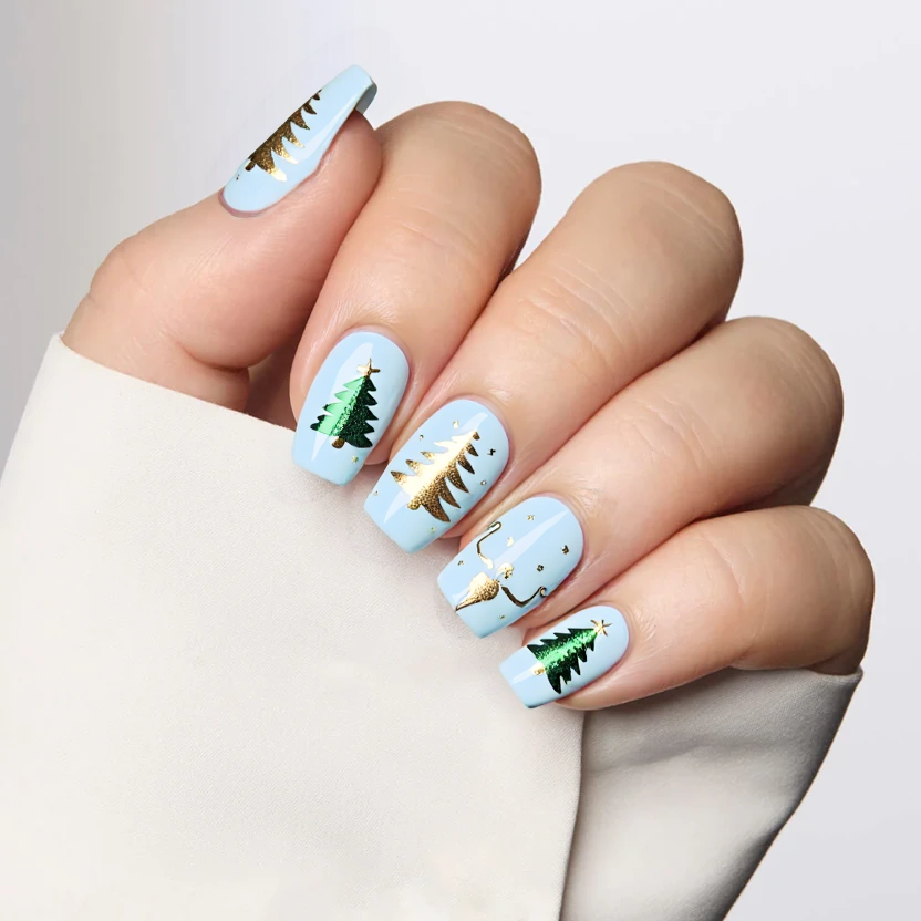 Nails featuring a soft icy blue base, creating a serene winter atmosphere. The ring fingers showcase delicate, hand-painted snowmen with gentle smiles, dressed in tiny scarves and hats, embodying the holiday spirit. The middle fingers are adorned with minimalist Christmas tree designs, each tree composed of subtle green and gold accents to keep the overall look elegant and understated. Tiny, glittery snowflakes dance around the remaining nails, adding dimension without overwhelming the serene palette. The finish is glossy, mimicking the shimmer of fresh snow under sunlight, perfectly complementing the almond shape of the nails.