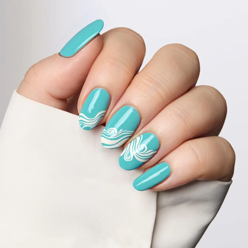 Nails painted in a soft teal blue base complemented by elegant white accents reflecting the essence of ocean waves. Two accent nails feature subtle white, swirling wave patterns that gracefully sweep across the surface, capturing a delicate movement reminiscent of the sea. The remaining nails display the calming teal blue, creating a harmonious balance without overwhelming the design. A glossy finish enhances the beachy feel, ensuring that these medium almond-shaped nails evoke a serene ocean ambiance, perfect for summer vibes.