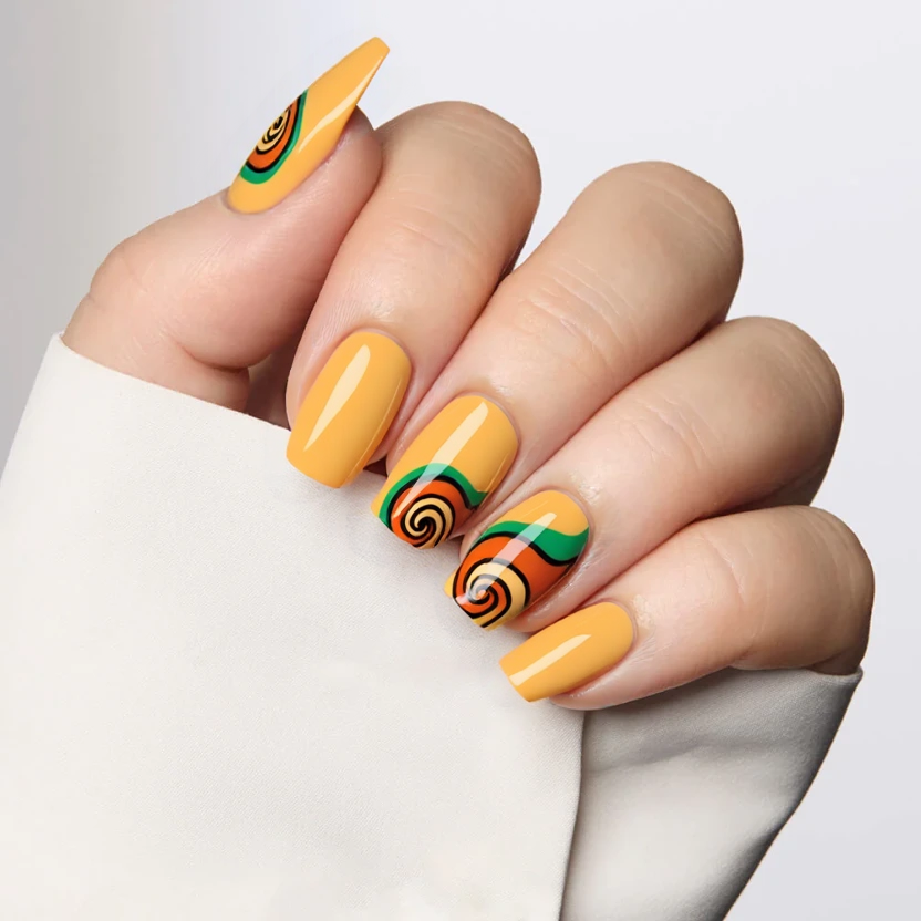 Nails adorned in a soft mustard yellow base, beautifully complementing the almond shape with its gentle curves. The ring fingers feature elegant, swirling patterns in retro shades of burnt orange and avocado green, reminiscent of the 70s aesthetic. These swirls gracefully flow from the cuticle to the tip, creating an organic yet slightly abstract look. The other nails remain a uniform mustard yellow for a balanced and cohesive design. A glossy finish enhances the warmth and inviting feel of the color palette, ensuring an understated yet stylish appeal perfect for medium almond nails.