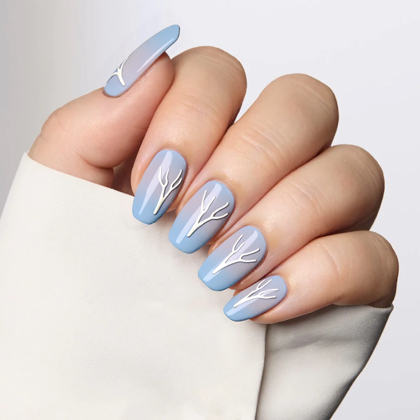 Elegant almond-shaped nails featuring a cohesive Valorant theme in soft pastel hues. The base color for all nails is a light dusty blue, creating a calming backdrop. On the ring fingers of each hand, a minimalistic white line design mimics the contours of Valorant agent silhouettes, with no more than three simple lines branching out, subtly conveying an abstract representation of a favorite character. The middle fingers showcase a delicate ombre effect transitioning from dusty blue to a soft lavender, accentuated by tiny, hand-drawn sparkles representing the excitement of the semi-finals. The rest of the nails remain plain in the same dusty blue, allowing the accent designs to stand out elegantly. A glossy finish adds a polished look, perfect for supporting your team while maintaining a stylish and unified appearance.