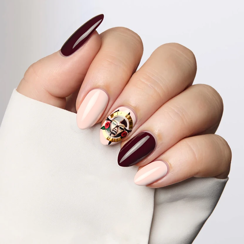 Designs for medium almond-shaped nails, perfect for a Guns N' Roses concert and a trip to Europe, harmonizing with a warm beige skin tone. The base color for all nails is a soft, creamy pastel pink, providing a delicate canvas. On the index and ring fingers, incorporate a minimalistic, swirling marble effect using muted shades of deep burgundy and soft gold, evoking the iconic rose imagery associated with the band. The other nails remain solid pink for a balanced look. A glossy finish enhances the overall elegance of the design while ensuring the nail art resonates with the edgy yet sophisticated vibe of the concert.